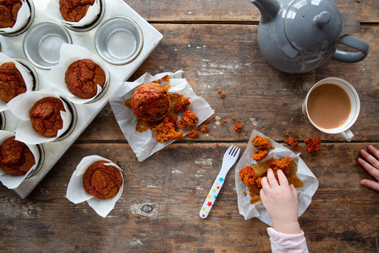 Madeleine's Sweet Potato and Red Pepper Muffins on a wooden table