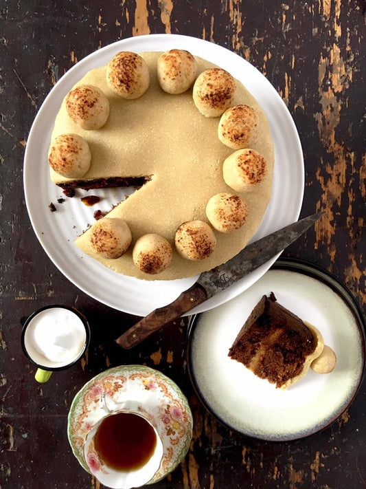 Family Friendly Simnel Cake on a plate with tea