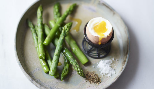 Boiled egg and greens on a plate