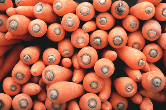 Fresh organic carrots in a large pile