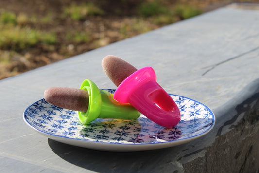 Babease baby pouch ice lollies on a plate outside