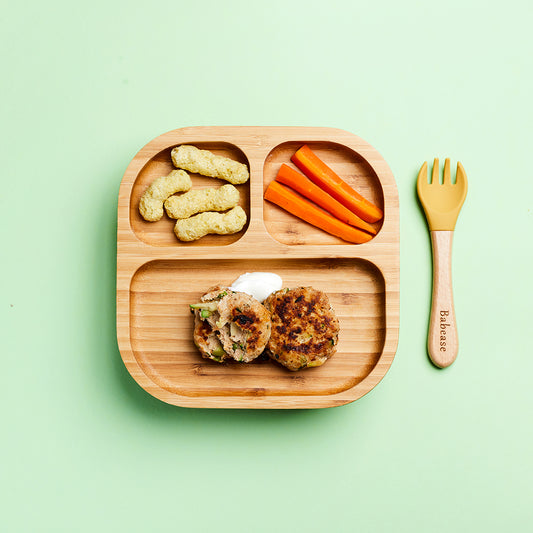 Bamboo segmented weaning dish with carrot batons, pea puffs and weaning friendly turkey meatballs