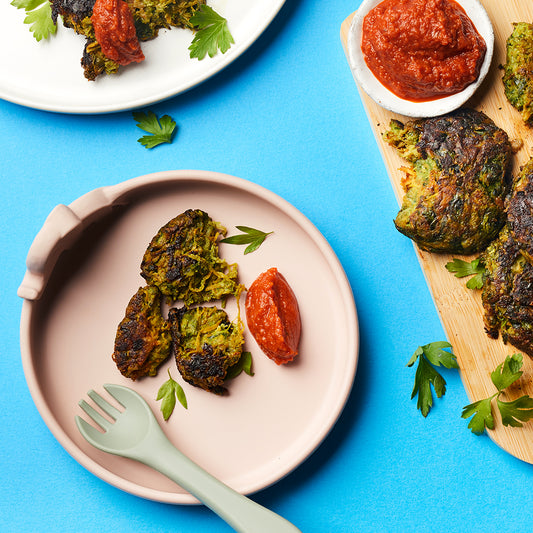 Veggie burgers served on a weaning plate with homemade tomato ketchup