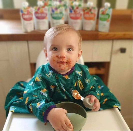 A weaning baby eating milk free food 