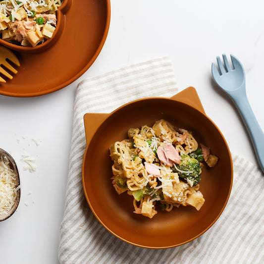 Pasta shapes in a creamy salmon and vegetable sauce